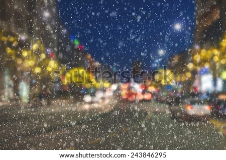 Night on streets in the city center with  New Year lighting arrangement and snow falling. Belgrade - Serbia