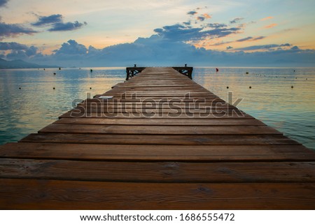 Golden sea sunset on the wooden pier. Spain, Mallorca. Stock fotó © 