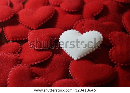 white heart on red hearts background theme for love and valentine on dark tone