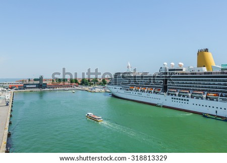 VENICE, ITALY- JUNE 7: Cruise ship docking at port of Venice, Italy on June 7, 2015. Cruise ships bringing many tourists to visit Venice all year round.