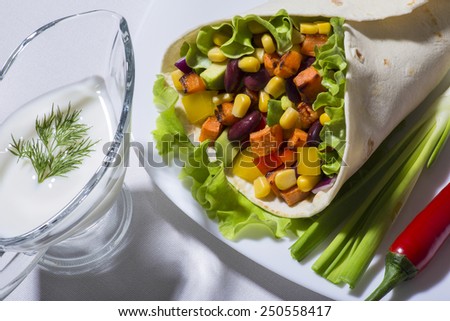 Burrito with grilled vegetables - raw food from traditional mexican kitchen