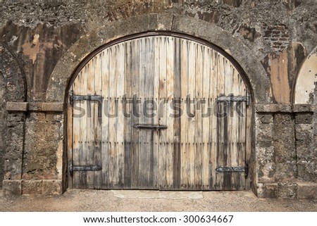 Big wooden hall door in a rustic stud farm