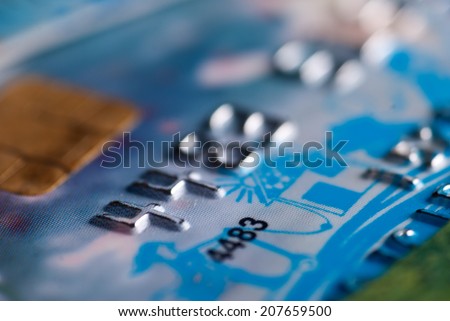 Close up of blue credit card with chip - shallow depth of field