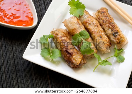 Homemade spring rolls with chili sauce and fresh coriander - nem from vietnamese cuisine