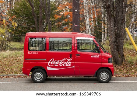 Nikko, Japan - October 31: Tiny minibus delivers Coca-cola to remote locations in Japanese mountains on October 31, 2012. Japanese companies use economy cars to deliver goods and passengers.