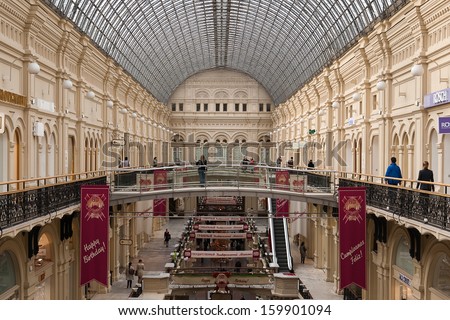 Moscow, Russia - September 17, 2013: People are inside of  Department Store.   Interior of  Department Store in the Moscow decorated for 120 anniversary of foundation.