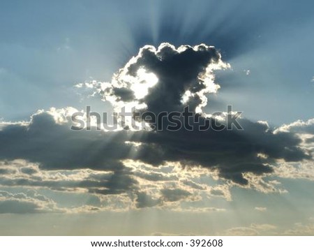 the beautiful sight of the sun shining from behind the clouds