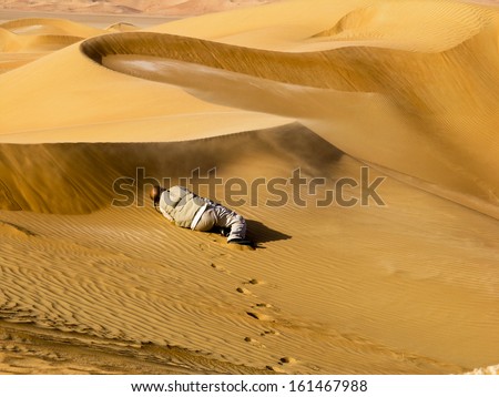 ABU DHABI, UAE - NOVEMBER 2005: Well-known National Geographic photographer and author, Reza, photographing the moving sands of the Arabian desert on November 25, 2005 in the Liwa Desert, UAE
