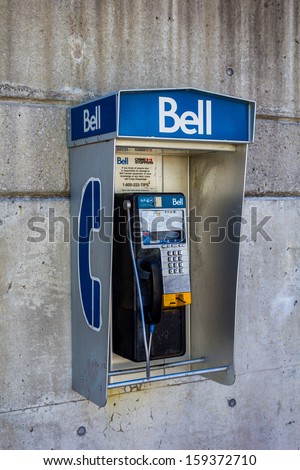TORONTO, CANADA - OCTOBER 11, 2013: A Bell public telephone attached to a wall outside on October 11 2013