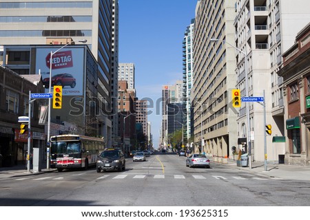TORONTO, CANADA- 18TH MAY 2014: A view down Bloor Street East during the day from Sherbourne