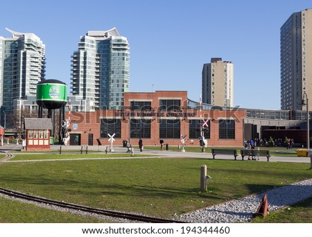 TORONTO, CANADA - 22ND MAY 2014: The outside of the Steam Whistle Brewing building during the day and people can be seen outside the building