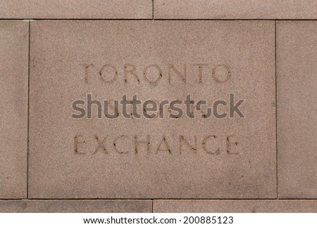 TORONTO, CANADA - 22 JUNE 2014: A closeup to an old faded sign for the historic Toronto Stock Exchange building