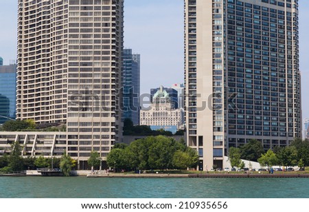 TORONTO, CANADA - 11 AUGUST 2014: The Royal York Hotel in the distance between two modern condos.