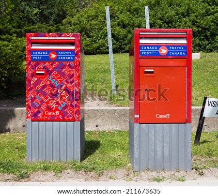 TORONTO, CANADA - 18 AUGUST 2014: Canada Post mail boxes in two different designs