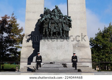 OTTAWA, CANADA -  12TH OCTOBER 2014: The base of the National War Memorial of Canada during the day showing two guards at the bottom