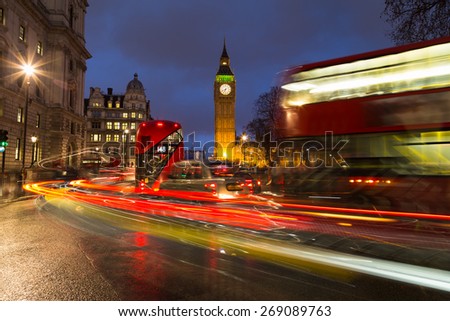 LONDON, UK - 24TH MARCH 2015:  Double Decker Buses, London Taxi and other traffic near Big Ben and Westminster during rush hour
