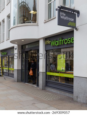 LONDON, UK - 9TH MARCH 2015:  The outside of a Little Waitrose Store in central London. People can be seen.