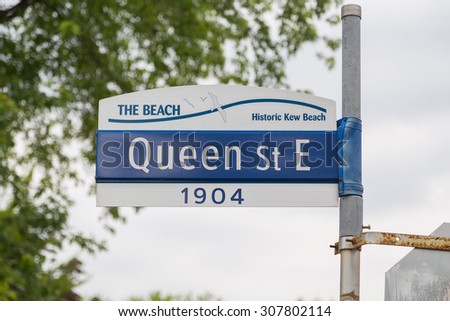 TORONTO, CANADA - 25TH JUNE 2015: A sign for Queen Street East in The Beach district of Toronto