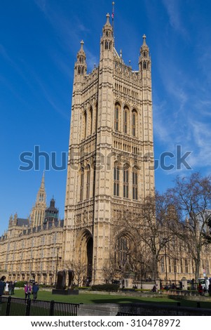 LONDON, UK - 10TH MARCH 2015: A view of the Victoria Tower in London. People can be seen near the base of the building.