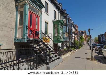 MONTREAL, CANADA - 17TH MAY 2015: Streets in Montreal during the day showing the buildings and style