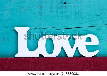 Love text in white on red and teal blue wooden texture background