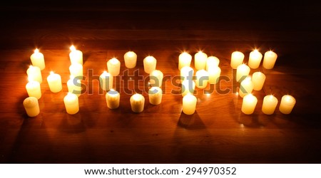 The word HOPE spelled out of burning candles