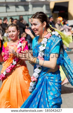 ODESSA, UKRAINE - APRIL 1: Devotees from Hare Krishna dancing with carnival revelers during the Vaishnava religious festival on the street Swallow April, 2013 in Odessa, Ukraine