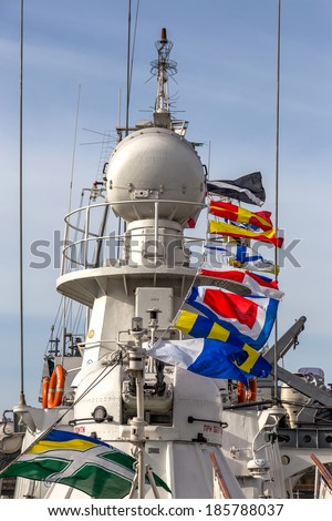 ODESSA, UKRAINE - APRIL 6: Maritime Boundary Navy, naval ships and sailors in the harbor Odessa. Military equipment of ships , guns and torpedo installation , marine flags , Ukraine, April 6, 2014 .