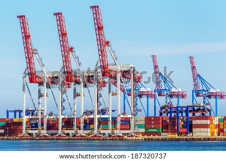 ODESSA, UKRAINE - APRIL 15: industrial  sea cargo cranes in the dock harbor of Odessa sea trading port cargo loading marine vessel in  Odessa cargo container terminal, April 15, 2014 Odessa, Ukraine