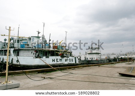 ODESSA, UKRAINE -  April 15: Old river trading port Ust -Danube . Human outdated repair river vessels , barges at the shipyard docks. Ancient Technology , April 15, 2014 Odessa, Ukraine