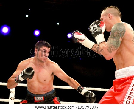 ODESSA, UKRAINE -31 May 2014: World heavyweight boxing champion, Alexander USYK - Ukraine and Cesar David CRENZ - Argentina in the boxing ring. Professional boxing, May 31, 2014 in Odessa, Ukraine.