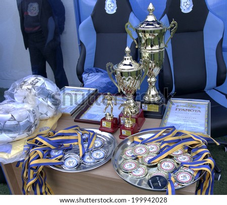 ODESSA, UKRAINE - April 25, 2012: Latex medals and cups winners of the championship at the stadium during a game of football club Chernomorets, April 24, 2012, Odessa, Ukraine