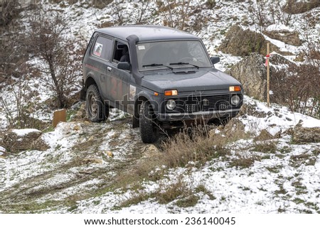 Odessa, Ukraine - December 6, 2014: Off-road 4x4 cars on the road passes sport routes in the winter mountains close-up, December 6, 2014 in Odessa, Ukraine.
