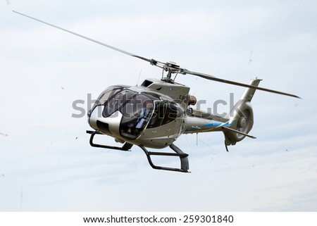 ODESSA, UKRAINE - June 4, 2013: Presentation of the private test light modern civil helicopter business class on a small private airport in the summer on a cloudy day