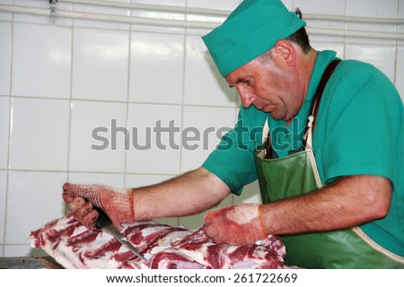 Odessa, Ukraine - July 7, 2007: The factory for the production of food from natural Ingredients. Food Convenience food. Production of dumplings, pancakes. Butcher shop. Butchering beef. Motion Blur.