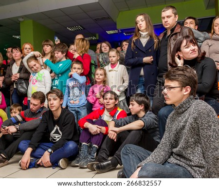 Odessa, Ukraine - April 4, 2015: The audience at a private concert during the creative light and music show fashionable jazz band in a small room. Emotionally.