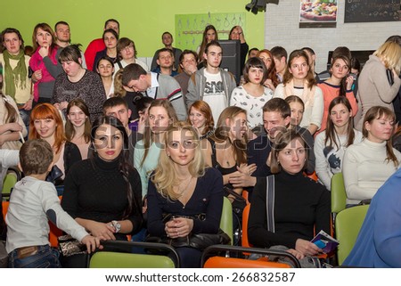 Odessa, Ukraine - April 4, 2015: The audience at a private concert during the creative light and music show fashionable jazz band in a small room. Emotionally.