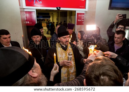 Odessa, Ukraine - April 11, 2015: Easter, parishioners of the Orthodox Church of the Holy Fire from Jerusalem at the feast of the Resurrection of Christ. Orthodox Easter