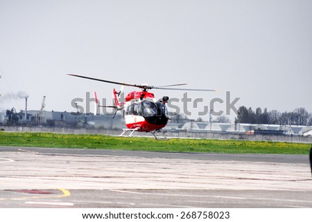 Odessa, Ukraine -29 April 2010: A helicopter of the Ministry of Emergency takes off from the airport in the disaster zone with doctors to save the Ministry of Emergency Situations of flood victims