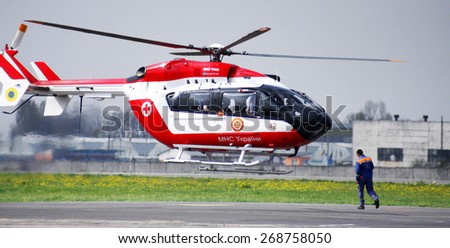 Odessa, Ukraine -29 April 2010: A helicopter of the Ministry of Emergency takes off from the airport in the disaster zone with doctors to save the Ministry of Emergency Situations of flood victims