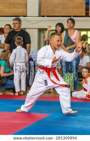 ODESSA, UKRAINE - June 7, 2015: Karate Tournament Streda children and adolescents. The battle on mat karatekas. Children, boys and girls making their first steps in learning the art of martial arts