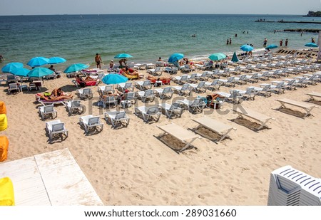 ODESSA, UKRAINE - JUNE 10 2015: Empty beach in Ukrainian Black Sea coast. Because of the civil war, economic decline and impoverishment of the population, the holiday season in Ukraine suffers crisis