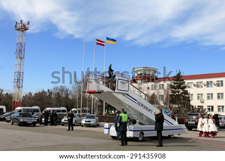ODESSA, UKRAINE - 15 March 2013: official visit to Ukraine, Odessa President of Latvia Andris Berzins. Solemn meeting at the airport. The plane of the President. Attributes of Latvia - Latvian flag