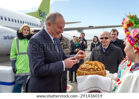 ODESSA, UKRAINE - 15 March 2013: official visit to Ukraine, Odessa President of Latvia Andris Berzins. Solemn meeting at the airport. The plane of the President. Attributes of Latvia - Latvian flag