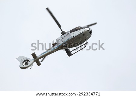 ODESSA, UKRAINE - June 4, 2013: Presentation of the private test light modern civil helicopter business class on a small private airport in the summer on a cloudy day