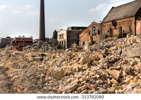 ODESSA, UKRAINE - 29 August 2015: Cleaning the ruins of an old industrial building after an earthquake. Landscape with the ruins of the old industrial factory buildings.
