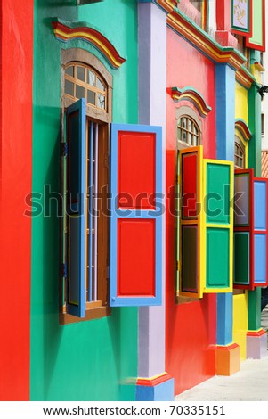 Colorful windows and details on a colonial house in Little India, Singapore.  Full of color, this picture has green, red, blue, yellow and pink.