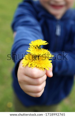 Similar – Image, Stock Photo Child hand with dandelion