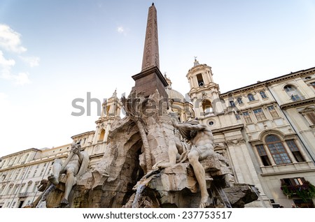 Fountain of the Four Rivers overlooked by the church of Sant\'Agnese in Agone in the beautifully Baroque Piazza Navona