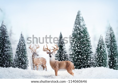 Winter landscape with deers,snow and fir tree.